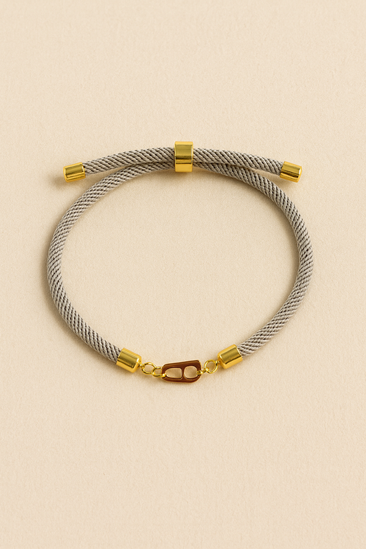 H gold & cord bracelet